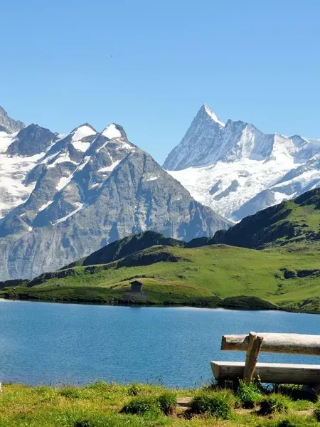 An alpine valley under snow on the Swiss rail line.