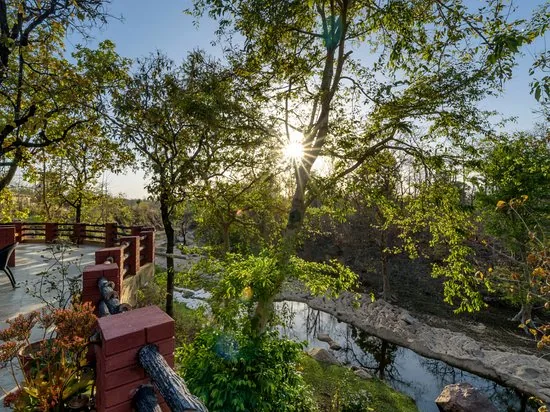 A viewing deck above a wooded river valley.