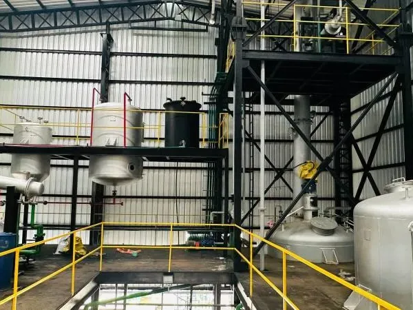 Plant and pipework on a working factory floor.