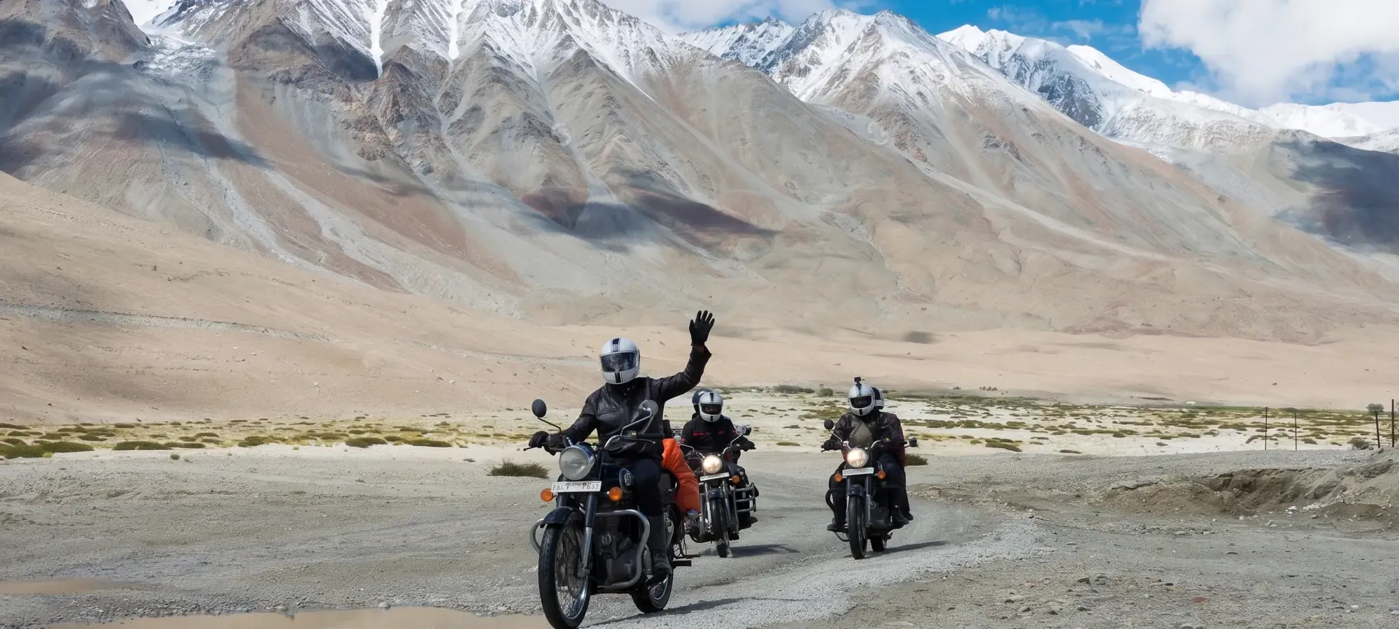 A mountain road climbing towards a pass, the kind of route that makes acclimatisation planning non-negotiable.