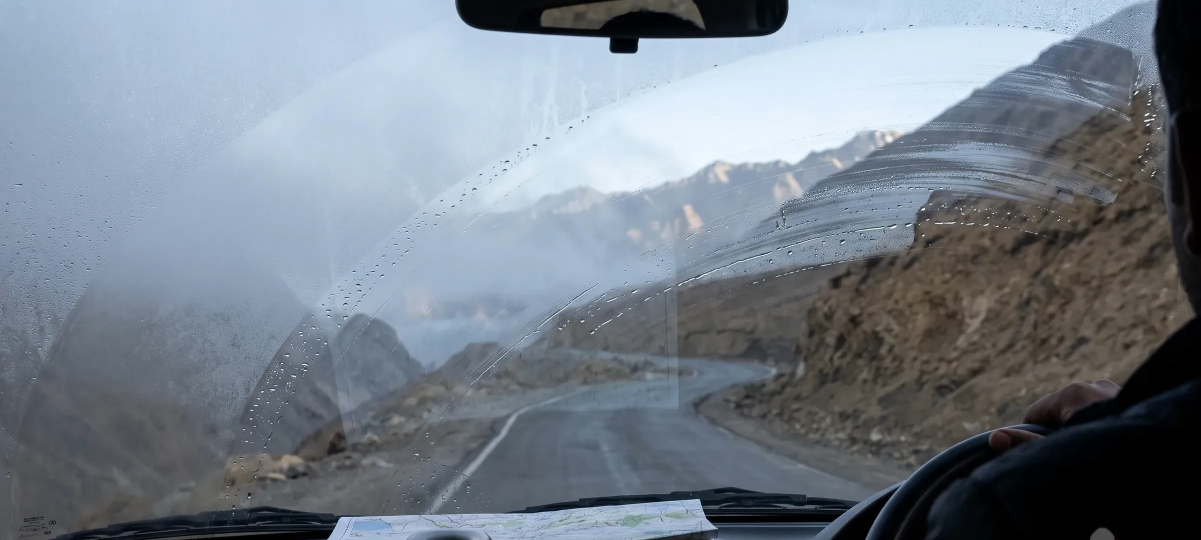 A high road seen from inside a vehicle, on a long overland day.