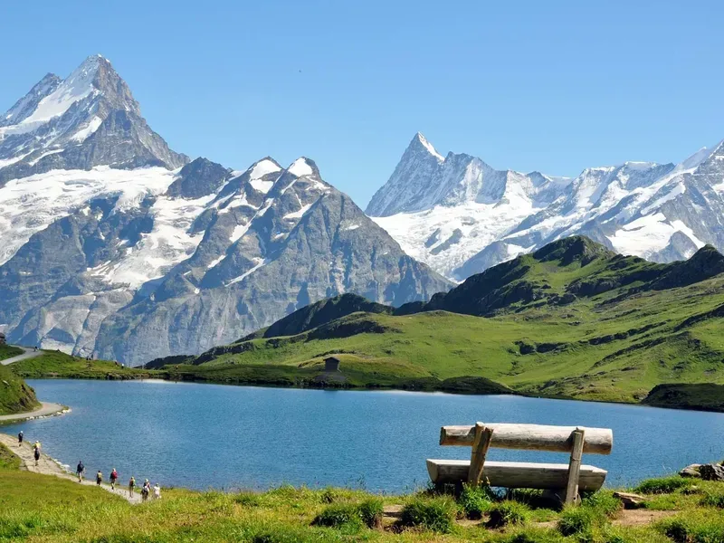 An alpine valley under snow on the Swiss rail line.